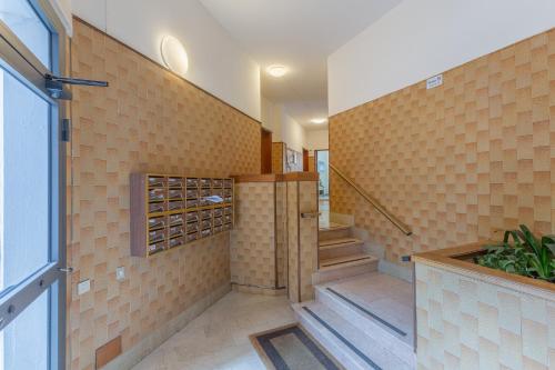 a tasting room with a wall of wine bottles at Ferrara Biscay Bay Apartment with balconies in Ferrara