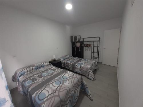 a bedroom with two beds and a ladder in it at BEC,CASA BARAKALDO al lado del BEC in Barakaldo