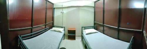 a room with two bunk beds in it at JoyNest Guest House in Patna