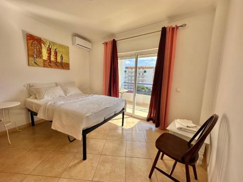 Ένα ή περισσότερα κρεβάτια σε δωμάτιο στο Rei Apartment