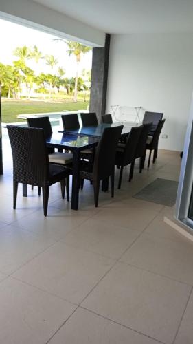 a dining room with a table and chairs at Mareazul Beachfront Resort - Casa Ancora in Playa del Carmen