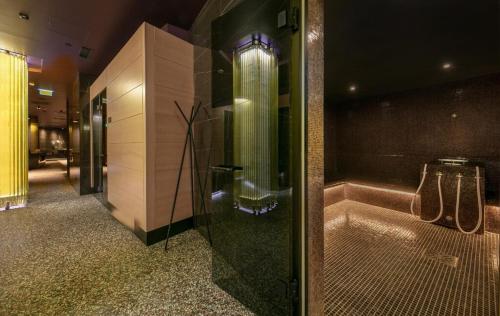 a bathroom with a shower and a bath tub at Sanpier Apartments in Veli Lošinj
