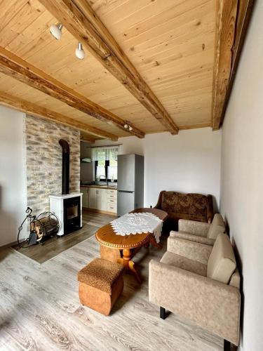a living room with a couch and a table at Magiczne Wzgórze in Ustroń
