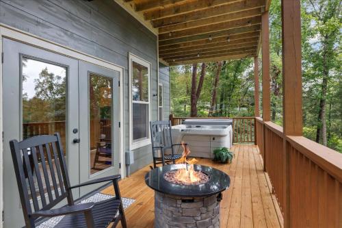 a screened porch with a fire pit on a house at Chasing the Son Cabin cabin in Sevierville