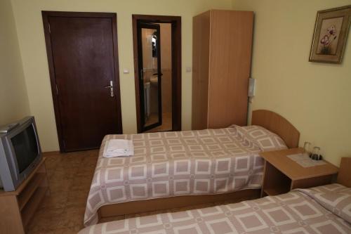 Postel nebo postele na pokoji v ubytování Family Hotel Papi