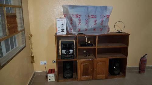 a room with a shelf with a bag on top at Annex House For Rent in Manjai Kunda