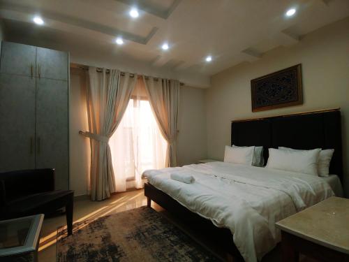 Кровать или кровати в номере Rakaposhi Villa
