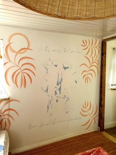 a wall with a writing on the side of a room at 1 Bed Chalet - Sleeps 4 - Pets Parking Wifi in Sheerness