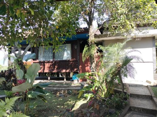 a house with a garden in front of it at D'kailash Retreat in Singaraja