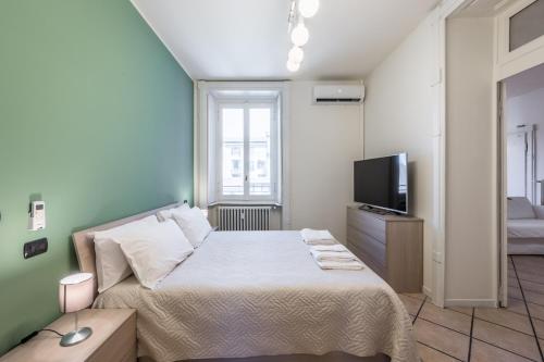 Donizetti Apt nel cuore del centro di Bergamoにあるベッド