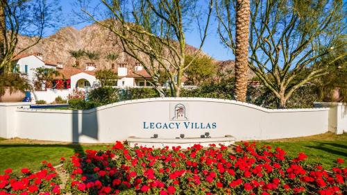 a sign for the legacy villas with red flowers at LV030 Private Upstairs Studio w Mountain Views in La Quinta