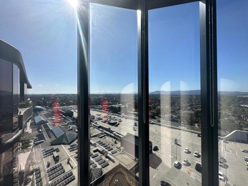 a view of a city from the top of a skyscraper at Top Floor Mountain View Luxury Rental Unit in SkyGarden Glen in Glen Waverley