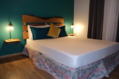 Una cama o camas en una habitación de Résidence Terre et Passion