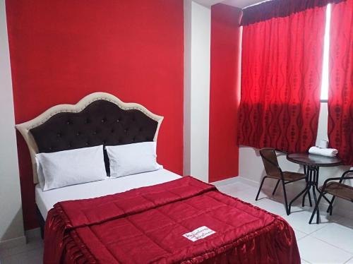 Postel nebo postele na pokoji v ubytování Alojamiento Los Jardines