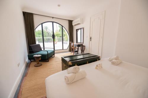 Postel nebo postele na pokoji v ubytování MORO Marrakech Boutique Hôtel