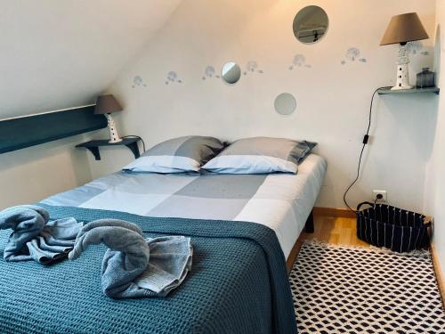Postel nebo postele na pokoji v ubytování Le Gîte du Phare vue sur mer