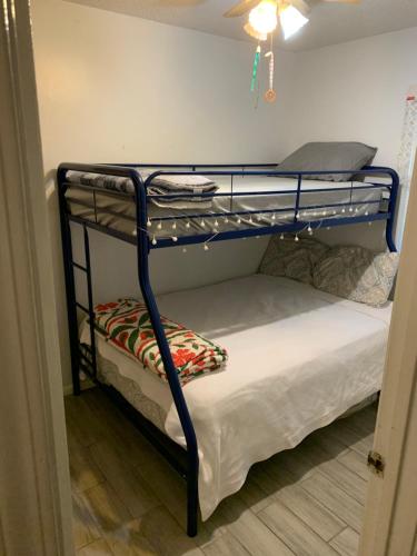 two bunk beds in a room with a ceiling at Little Covington Home in Covington