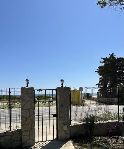 a gate in front of a playground at Marina Zahara in Zahara de los Atunes