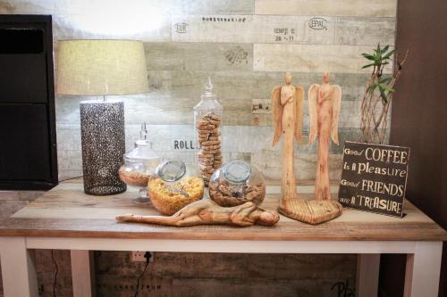 a table topped with lots of different types of food at Siesta Guesthouse & Wedding Venue - Frankfort in Frankfort
