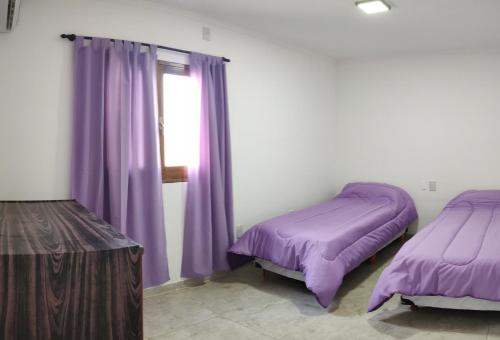 Postel nebo postele na pokoji v ubytování Altos de Mitre