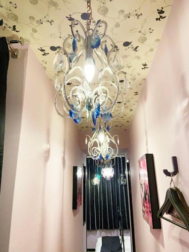 a chandelier hanging from a ceiling in a room at YOL in Saijo