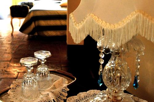 two glass vases on a tray on a table at Relais Castelluccio Palusse in Città della Pieve