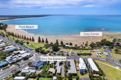 an aerial view of the beach and the ocean at Cosy Corner Hideaway in Torquay