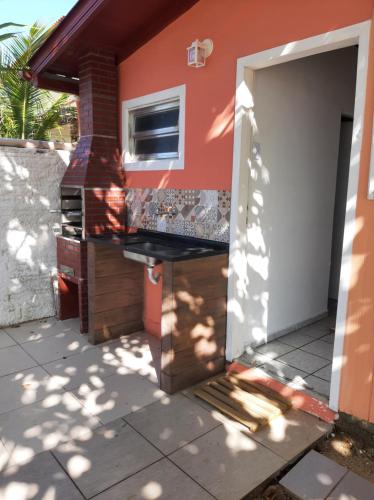 a house being constructed with an open door at Pé na areia, casa na praia de frente para o mar in Florianópolis