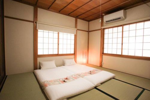 Postel nebo postele na pokoji v ubytování 飛騨高山　一の心