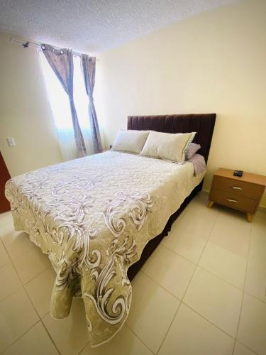 a bedroom with a bed and a window at Apartamento Madrid cund in Madrid