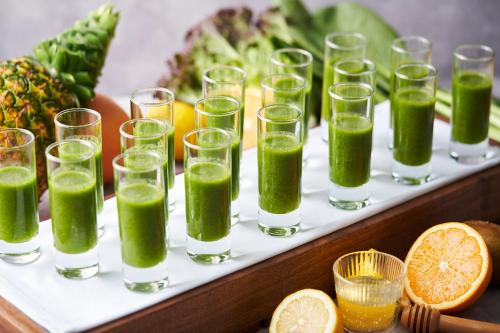 a tray of glasses filled with green juice at Art Hotel Osaka Bay Tower in Osaka