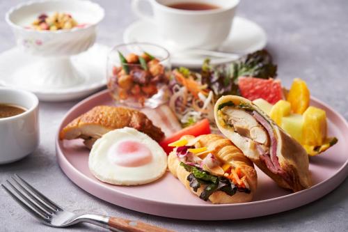 a pink plate of food on a table at Art Hotel Osaka Bay Tower in Osaka