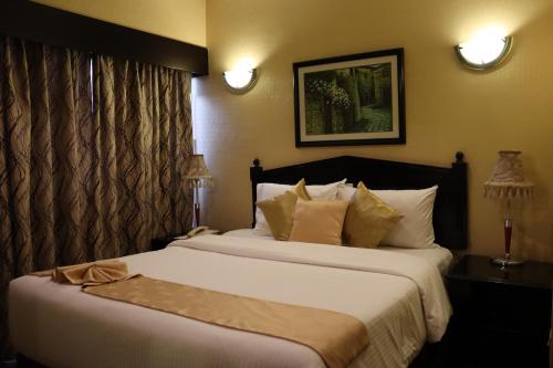 Voodi või voodid majutusasutuse GSS Palace Hotel toas