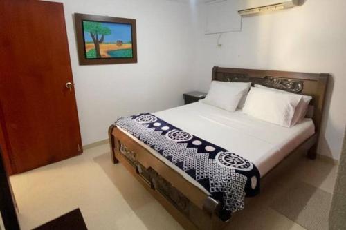 a bedroom with a bed in a room at RH06 Riohacha apto con vista mar 7 piso 4 personas in Ríohacha