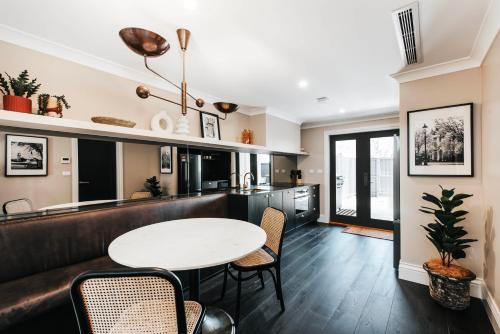 a living room with a table and chairs at McKenna Terraces in Mudgee
