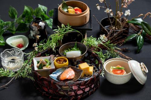 two baskets filled with different types of food on a table at Sado Resort Hotel Azuma in Sado