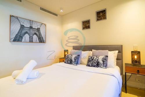 Postelja oz. postelje v sobi nastanitve Zen Seaside 1BR Waterfront Apt