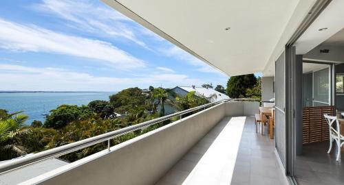 an open balcony with a view of the ocean at The Drift in Nelson Bay