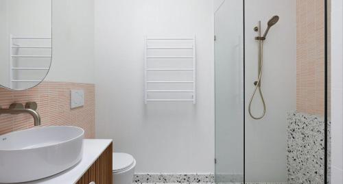 a bathroom with a sink and a shower at The Willows in Wickham