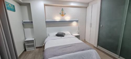 Postel nebo postele na pokoji v ubytování EL FARO HOTEL