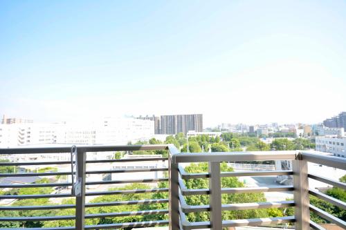 a balcony with a view of a city at Residence Hotel Hakata 8 in Fukuoka