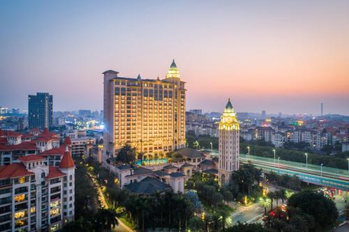 a view of a city skyline at night at Chateau Star River Guangzhou-Free Shuttle Between Hotel And Exhibition Center & Welcome Drink During Canton Fair in Guangzhou