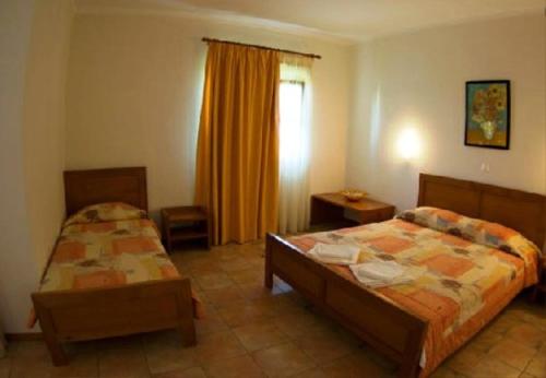 Ένα ή περισσότερα κρεβάτια σε δωμάτιο στο Gi Ga Mar