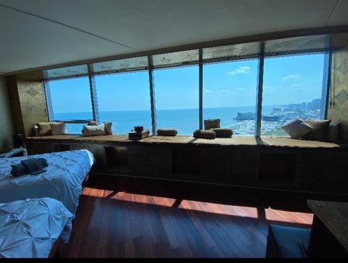 a large room with a view of the ocean at Beach Front with Ocean View in Atlantic City