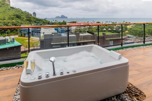 a bath tub sitting on top of a balcony at Panan Krabi Resort in Ao Nang Beach