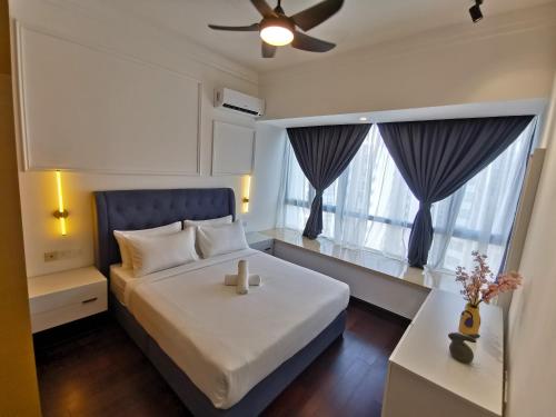 a small bedroom with a bed and a window at R&F PRINCESS COVE at ANJU in Johor Bahru