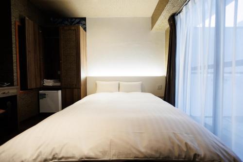 Giường trong phòng chung tại Hotaku HOTEL - Vacation STAY 98852v