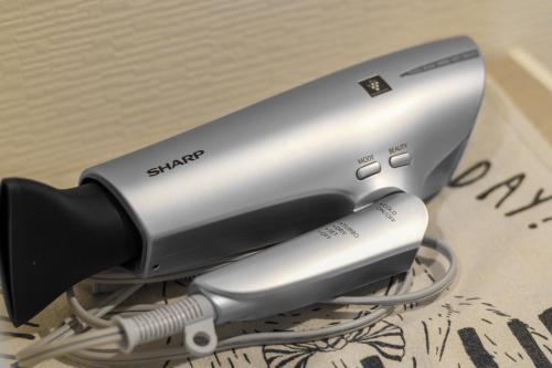 a hair dryer sitting on top of a table at Comfy Stay TDS in Nara