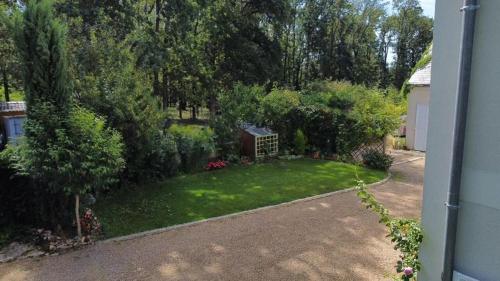 an aerial view of a yard with trees and a house at Logis du Lièvre d'or in Montbazon
