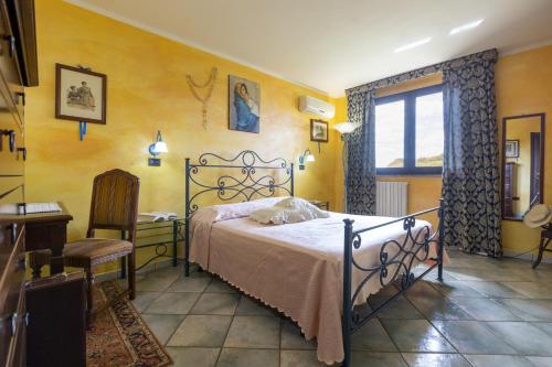 Tempat tidur dalam kamar di Villa Maria Antonietta